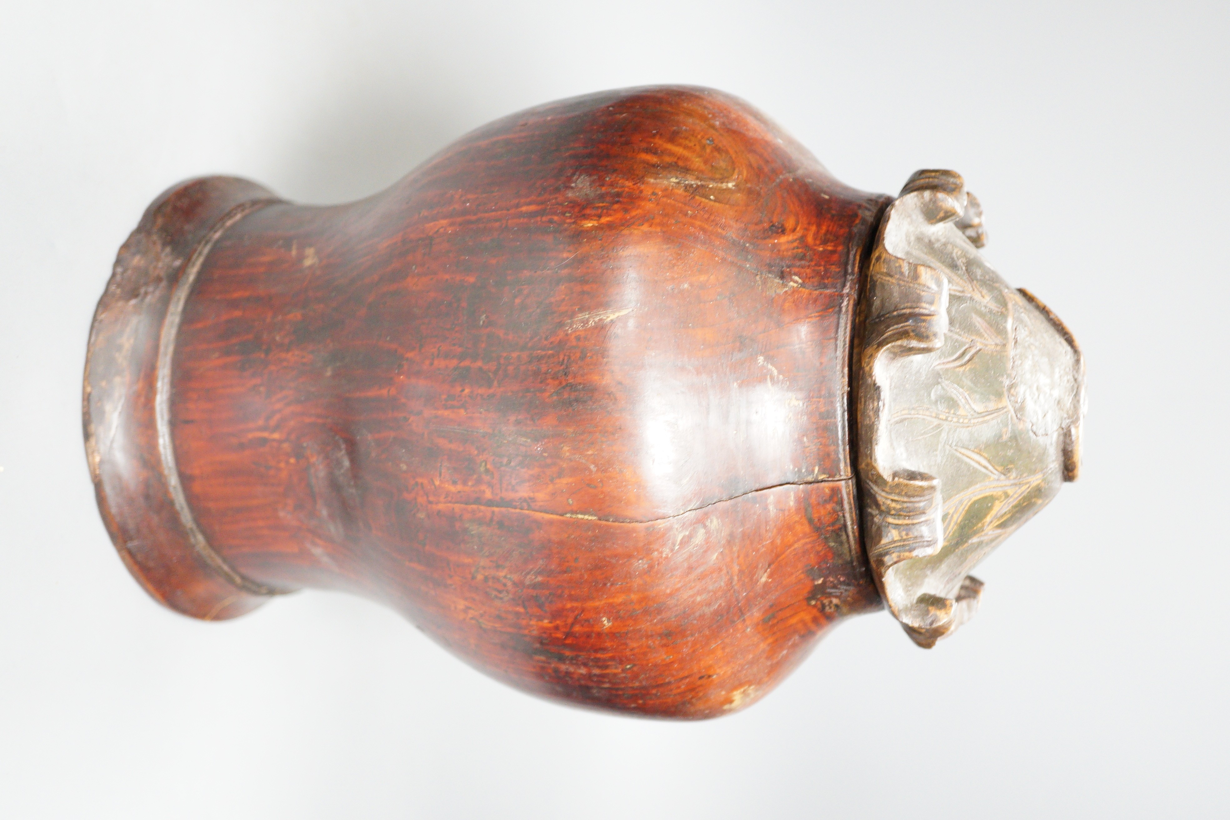 A Chinese carved wood jar and cover, 33cm